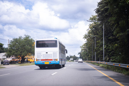 tourist bus ,Comfortable public bus driving through the clear sky highway. Travel, tourism concept.の写真素材