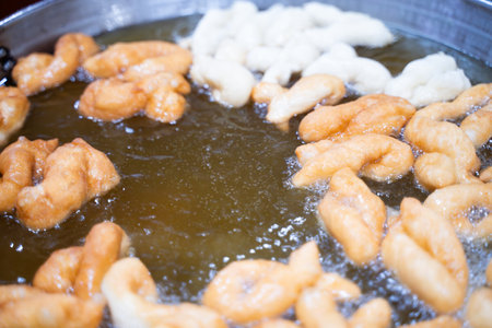 Patongko is being fried in a large pan. Breakfast for early risers.の写真素材