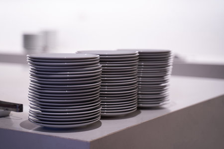 Many white dishes were placed on the table. In a coffee shop or restaurant.の写真素材