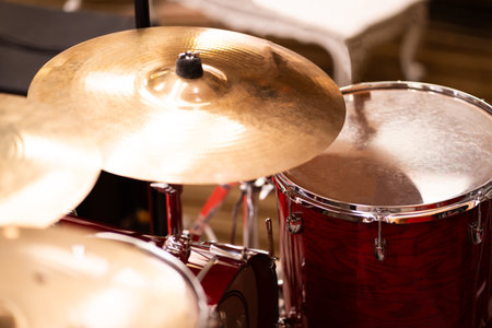 Complete set of cymbal instruments with complete red drums in studio music concept.