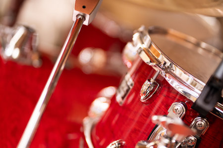 Complete set of red drums in studio, bokeh light background.の写真素材