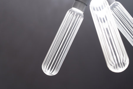 Chandeliers, ceiling lights on a black background.の写真素材