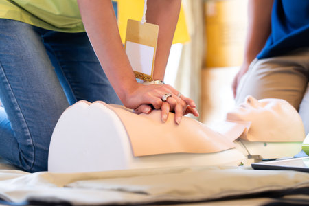 Demonstration of heart pumping through a dummy , basic emergency first aid.