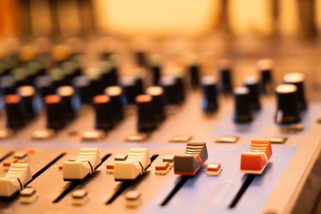 Close-up of the music mixer control panel. colorful buttons The background uses a blurring...