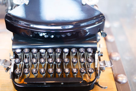 vintage typewriter ,old typewriter on bokeh light background.の写真素材