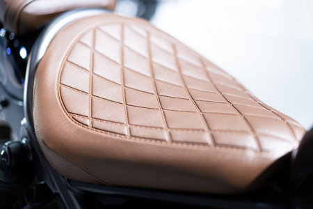 Classic motorcycle leather seat Brown big bike seat decorated with luxurious patterns.の写真素材