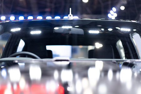 Front console and steering wheel and rearview mirror Looking through the windshield Focus on a...