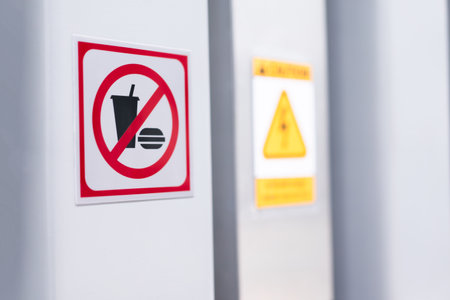 No food and beverages allowed in this area sign on white wall background.の写真素材