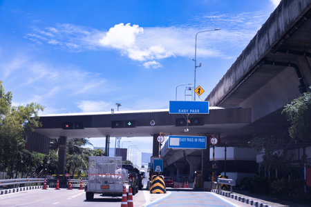 The car pays the cashier for the entrance to the motorway toll gate.の写真素材