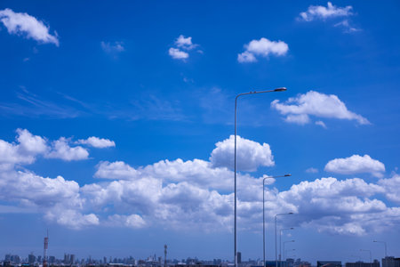 Sky background with white clouds on a clear day, afternoon in the capital city.の写真素材