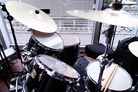 Part of a drum set with cymbals in a music studio, music practice room.の写真素材