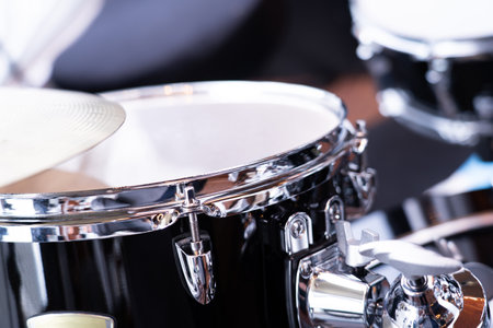 Drum set, selective focus on blurred background in studio.の写真素材