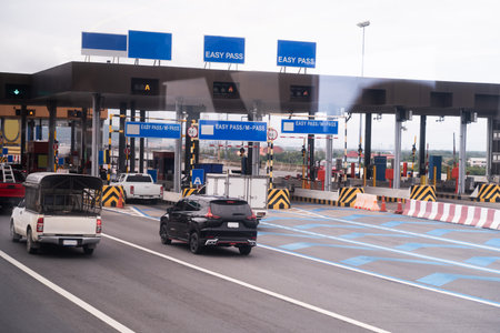 The car pays the cashier for the entrance to the motorway toll gate.の写真素材