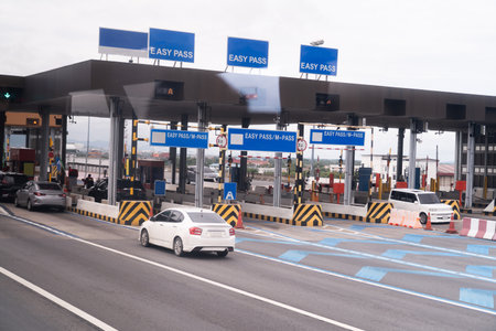 The car pays the cashier for the entrance to the motorway toll gate.の写真素材