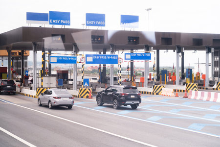 The car pays the cashier for the entrance to the motorway toll gate.の写真素材