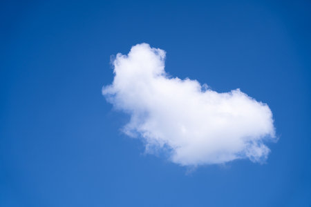 Sky background with white clouds gathering in clusters on a bright day.の写真素材