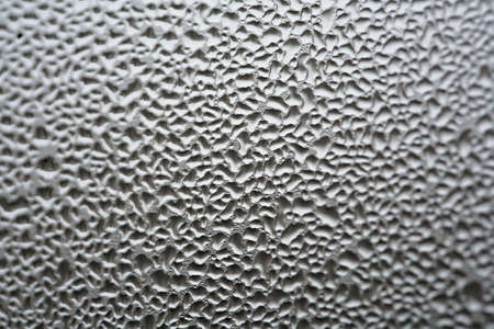 Steamy windows with lots of water dropsの写真素材