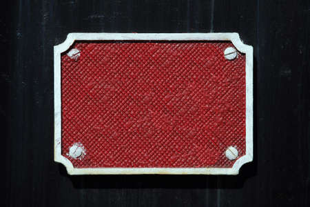 Red metallic board on a black backgroundの写真素材