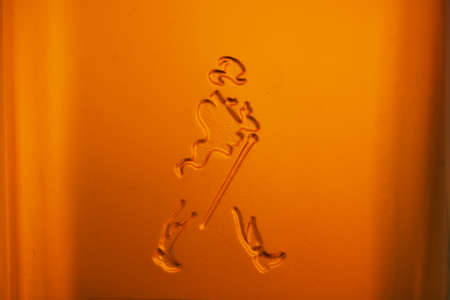 Bucharest, Romania - July 15, 2011: Close-up shot of a bottle of Johnnie Walker whiskey. Johnnie Walker is a brand of Scotch Whisky owned by Diageo and originated in Kilmarnock, Ayrshire, Scotland.のeditorial素材