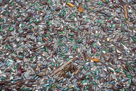 Bicaz, Romania - July 12, 2011: Lots of plastic bottles float on lake Bicaz's surface in Romania.のeditorial素材