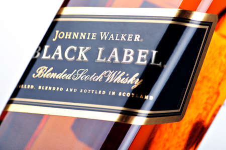Bucharest, Romania - April 17, 2012: Close-up shot of a bottle of Johnnie Walker whiskey. Johnnie Walker is a brand of Scotch Whisky owned by Diageo and originated in Kilmarnock, Ayrshire, Scotland.のeditorial素材