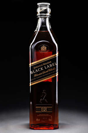 Bucharest, Romania - April 17, 2012: Close-up shot of a bottle of Johnnie Walker whiskey. Johnnie Walker is a brand of Scotch Whisky owned by Diageo and originated in Kilmarnock, Ayrshire, Scotland.のeditorial素材