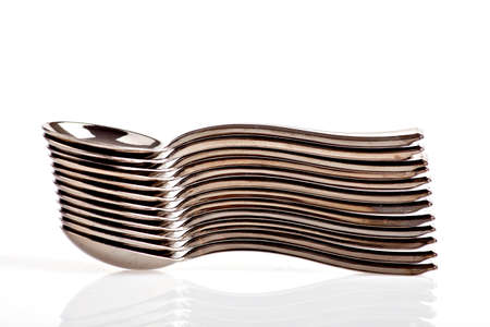 Color shot of a pile of spoonsの写真素材