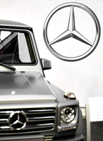 Bucharest, Romania - October 22, 2012: Mercedes logo is displayed next to a car in Bucharest....