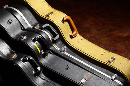 Color shot of four vintage guitar casesの写真素材