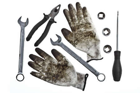 Various tools and a pair of dirty glovesの写真素材
