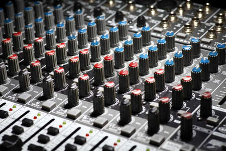 Detail of a music mixer desk with various knobsの写真素材