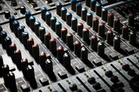 Detail of a music mixer desk with various knobsの写真素材