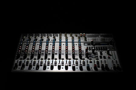 Bucharest, Romania - January 19, 2013: Detail of a Behringer music mixer desk with various knobs. Behringer is a German audio equipment company founded in 1989.のeditorial素材