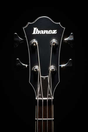 Bucharest, Romania - January 19, 2013: Head stock of an Ibanez electrical bass guitar. Ibanez is a...