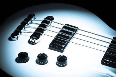 Dark shot of an electrical bass guitar