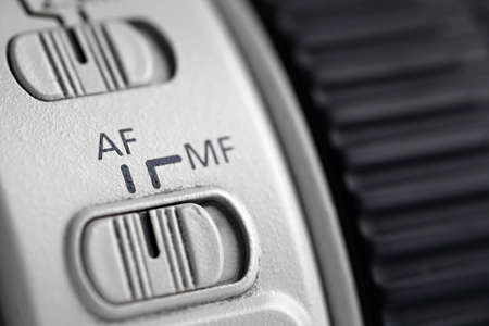 Detail of the auto focus switch on a long photo lenses