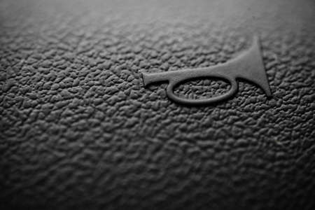 Close up shot of the horn button on a car's steering wheelの写真素材