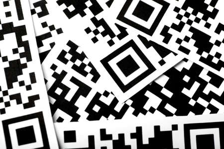 Detail of a few qr codes printed on paperの写真素材