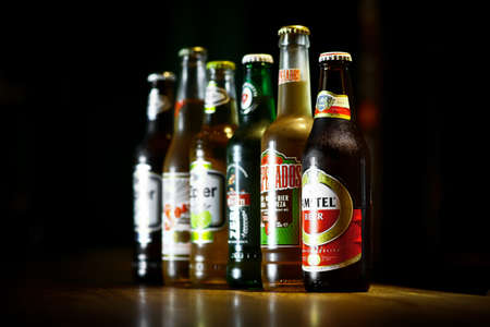 Bucharest, Romania - May 2, 2013: Close-up shot of a row of various beer bottles among which Amstel,...