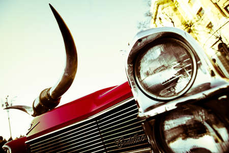 Bucharest, Romania - April 6, 2013: Color detail on the headlight of a vintage Cadillac. Cadillac is a luxury vehicle brand owned by General Motors.のeditorial素材