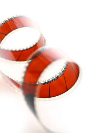 Detail of a red movie film isolated on whiteの写真素材