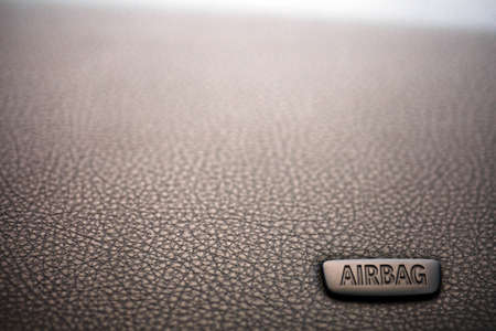 The word "Airbag" is written on a car's dashboardの写真素材