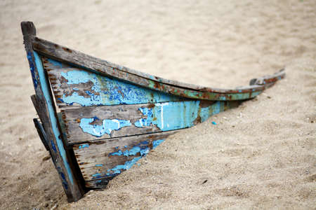 Color picture of an abandoned boat stuck in sandの写真素材