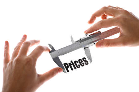 Close up shot of a caliper measuring the word "Prices"の写真素材