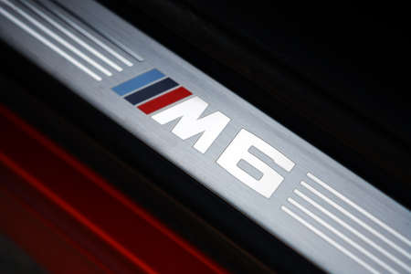 Bucharest, Romania - August 4, 2013: Color shot with the "M6" logo on a BMW M6 car's door. The BMW M6 is a high-performance version of the BMW 6-Series, developed by BMW's motorsport division, BMW M.のeditorial素材