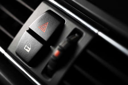 Detail of a warning button in a carの写真素材