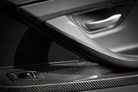 Detail the button controlling the window in a car