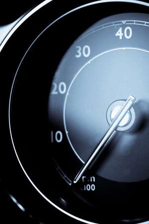 Detail of a tachometer in a car