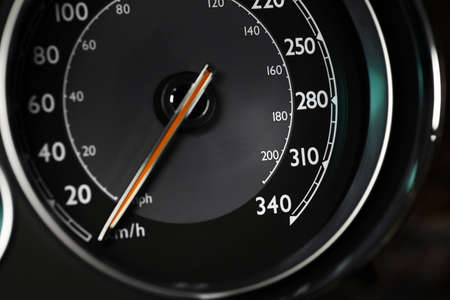 Close up shot of a speedometer in a car