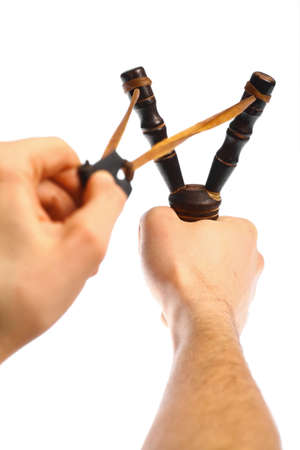 Color shot with two hands holding a vintage slingshotの写真素材